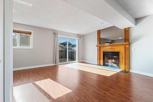 336 Whitworth Way Ne, Calgary, AB - Indoor Photo Showing Living Room With Fireplace