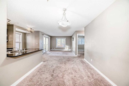 8201-403 Mackenzie Way Sw, Airdrie, AB - Indoor Photo Showing Other Room