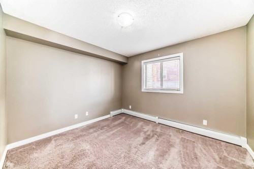 8201-403 Mackenzie Way Sw, Airdrie, AB - Indoor Photo Showing Other Room