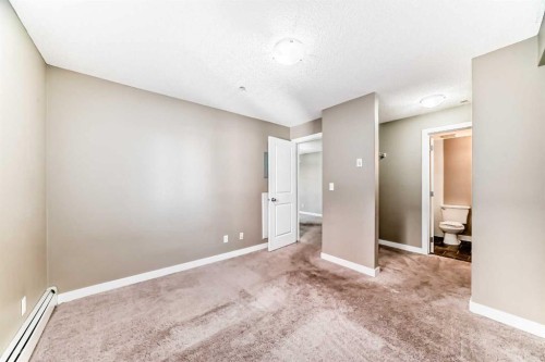 8201-403 Mackenzie Way Sw, Airdrie, AB - Indoor Photo Showing Other Room