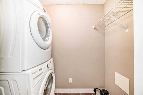 8201-403 Mackenzie Way Sw, Airdrie, AB - Indoor Photo Showing Laundry Room