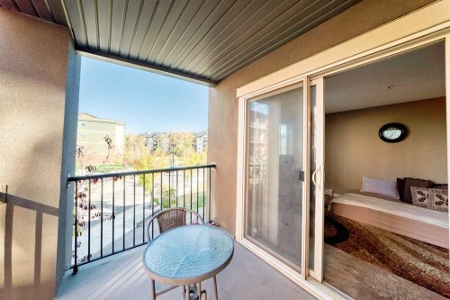 8201-403 Mackenzie Way Sw, Airdrie, AB - Outdoor With Balcony With Exterior