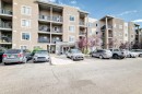 8201-403 Mackenzie Way Sw, Airdrie, AB  - Outdoor With Balcony With Facade 