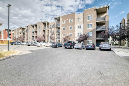 8201-403 Mackenzie Way Sw, Airdrie, AB - Outdoor With Balcony With Facade