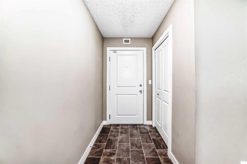 8201-403 Mackenzie Way Sw, Airdrie, AB - Indoor Photo Showing Other Room