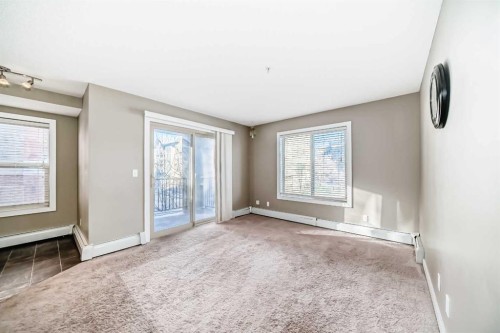 8201-403 Mackenzie Way Sw, Airdrie, AB - Indoor Photo Showing Other Room