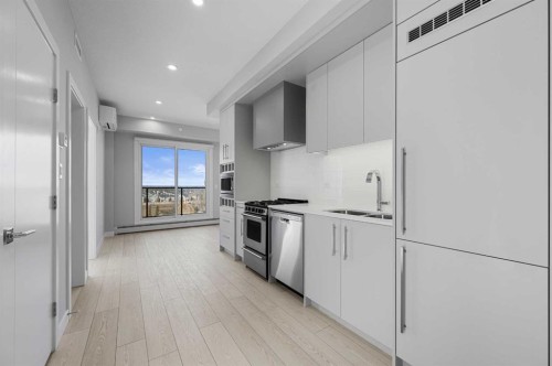 601-8230 Broadcast Avenue Sw, Calgary, AB - Indoor Photo Showing Kitchen With Double Sink With Upgraded Kitchen