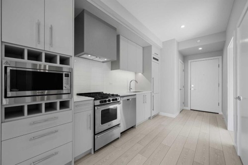 601-8230 Broadcast Avenue Sw, Calgary, AB - Indoor Photo Showing Kitchen With Upgraded Kitchen