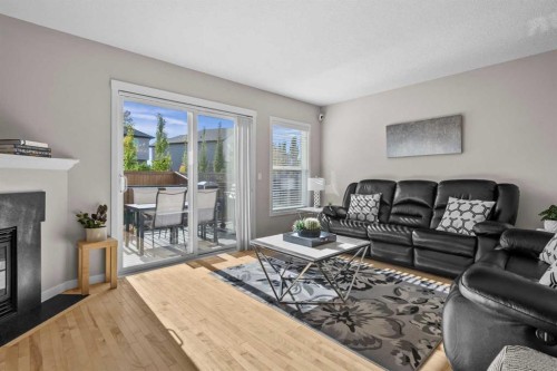 510 Cranston Drive Se, Calgary, AB - Indoor Photo Showing Living Room With Fireplace