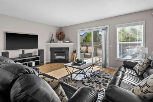 510 Cranston Drive Se, Calgary, AB - Indoor Photo Showing Living Room With Fireplace