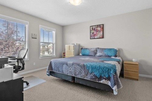 510 Cranston Drive Se, Calgary, AB - Indoor Photo Showing Bedroom