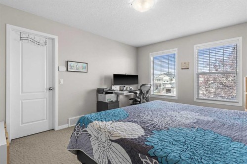 510 Cranston Drive Se, Calgary, AB - Indoor Photo Showing Bedroom
