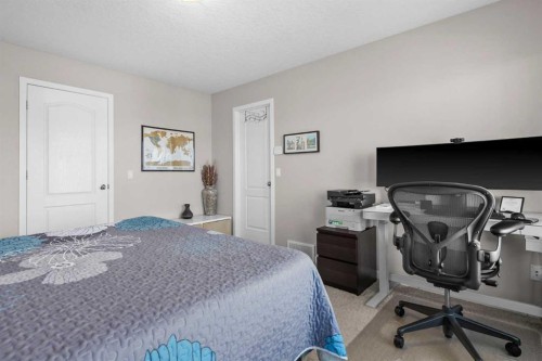 510 Cranston Drive Se, Calgary, AB - Indoor Photo Showing Bedroom