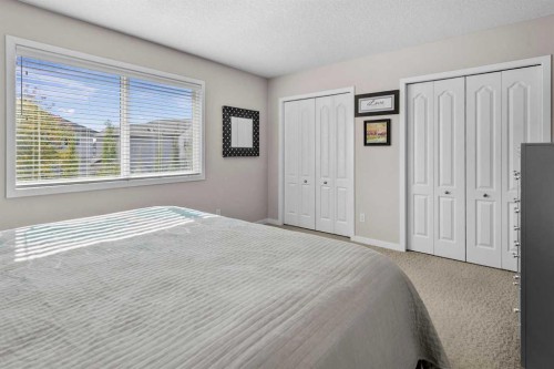 510 Cranston Drive Se, Calgary, AB - Indoor Photo Showing Bedroom