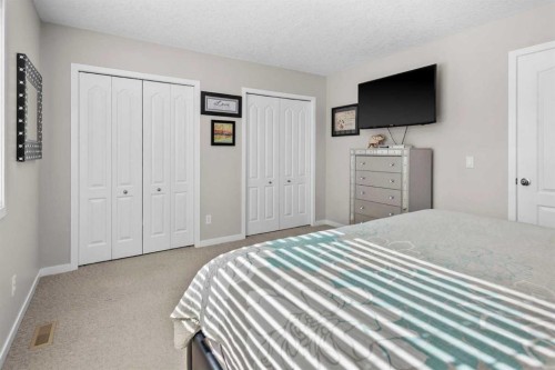 510 Cranston Drive Se, Calgary, AB - Indoor Photo Showing Bedroom