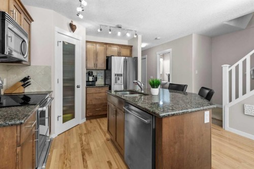 510 Cranston Drive Se, Calgary, AB - Indoor Photo Showing Kitchen With Stainless Steel Kitchen With Double Sink With Upgraded Kitchen