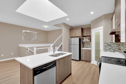 87 Baysprings Way Sw, Airdrie, AB - Indoor Photo Showing Kitchen With Double Sink