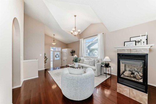 1046 Channelside Way Sw, Airdrie, AB - Indoor Photo Showing Living Room With Fireplace
