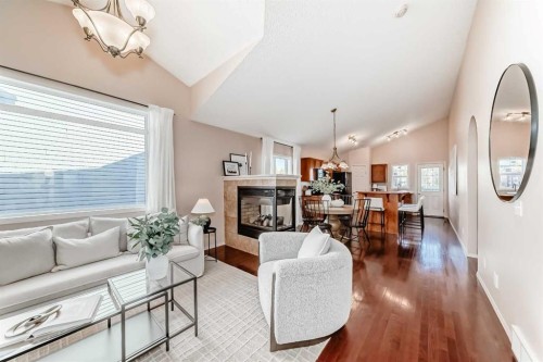 1046 Channelside Way Sw, Airdrie, AB - Indoor Photo Showing Living Room With Fireplace