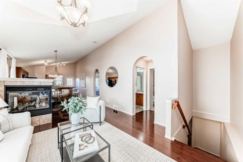 1046 Channelside Way Sw, Airdrie, AB - Indoor Photo Showing Living Room With Fireplace