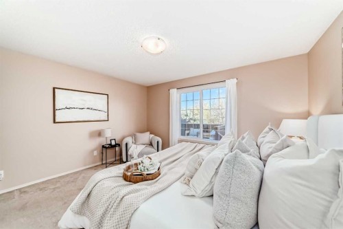 1046 Channelside Way Sw, Airdrie, AB - Indoor Photo Showing Bedroom