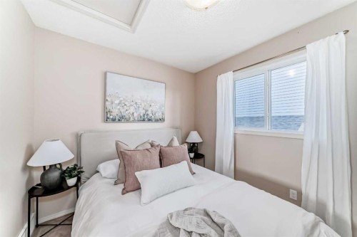 1046 Channelside Way Sw, Airdrie, AB - Indoor Photo Showing Bedroom