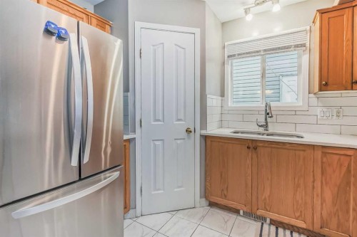 163 Taracove Estate Drive Ne, Calgary, AB - Indoor Photo Showing Kitchen With Double Sink