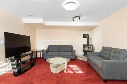 331 Coverdale Court Ne, Calgary, AB - Indoor Photo Showing Living Room With Fireplace