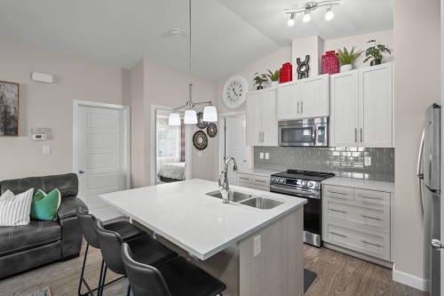 1426-2461 Baysprings Link Sw, Airdrie, AB - Indoor Photo Showing Kitchen With Stainless Steel Kitchen With Double Sink With Upgraded Kitchen