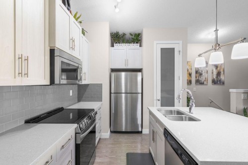1426-2461 Baysprings Link Sw, Airdrie, AB - Indoor Photo Showing Kitchen With Stainless Steel Kitchen With Double Sink With Upgraded Kitchen