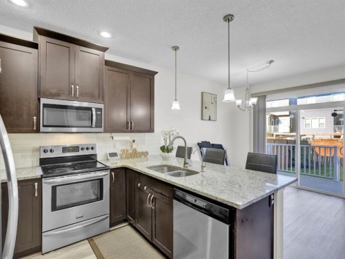 551 Evansborough Way Nw, Calgary, AB - Indoor Photo Showing Kitchen With Double Sink With Upgraded Kitchen