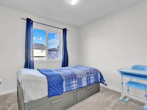 551 Evansborough Way Nw, Calgary, AB - Indoor Photo Showing Bedroom