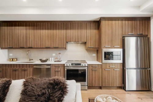7320-1802 Mahogany Boulevard Se, Calgary, AB - Indoor Photo Showing Kitchen With Stainless Steel Kitchen