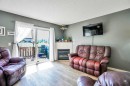 702-760 Railway Gate Sw, Airdrie, AB  - Indoor Photo Showing Living Room With Fireplace 