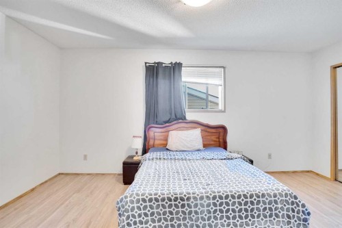 52 Erin Park Drive Se, Calgary, AB - Indoor Photo Showing Bedroom