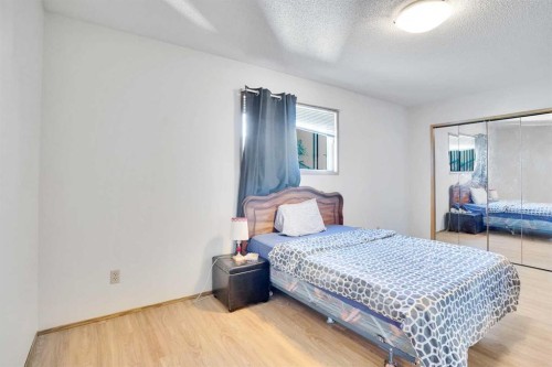 52 Erin Park Drive Se, Calgary, AB - Indoor Photo Showing Bedroom