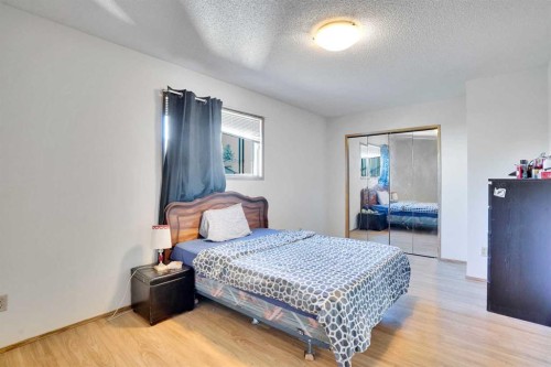 52 Erin Park Drive Se, Calgary, AB - Indoor Photo Showing Bedroom