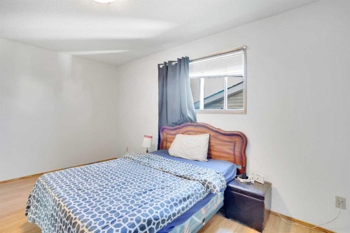 52 Erin Park Drive Se, Calgary, AB - Indoor Photo Showing Bedroom