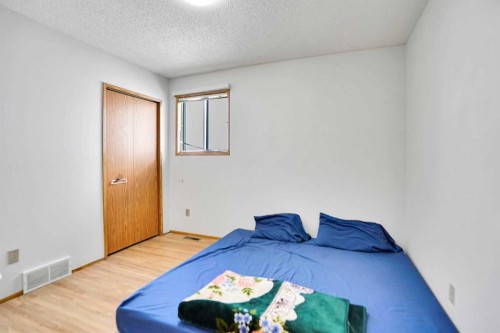 52 Erin Park Drive Se, Calgary, AB - Indoor Photo Showing Bedroom