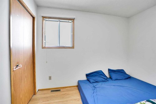 52 Erin Park Drive Se, Calgary, AB - Indoor Photo Showing Bedroom