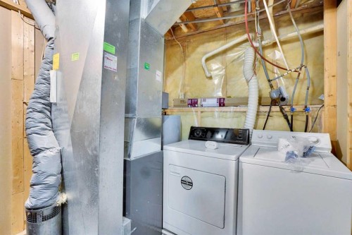52 Erin Park Drive Se, Calgary, AB - Indoor Photo Showing Laundry Room