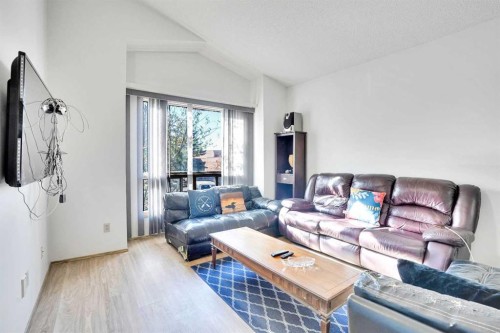 52 Erin Park Drive Se, Calgary, AB - Indoor Photo Showing Living Room