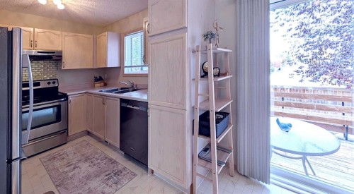 12 Shawbrooke Court Sw, Calgary, AB - Indoor Photo Showing Kitchen With Stainless Steel Kitchen With Double Sink