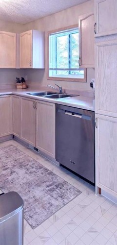 12 Shawbrooke Court Sw, Calgary, AB - Indoor Photo Showing Kitchen With Double Sink