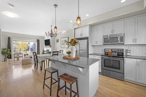 8048 Masters Boulevard Se, Calgary, AB - Indoor Photo Showing Kitchen With Upgraded Kitchen
