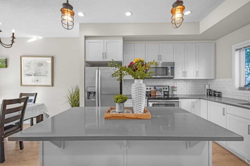 8048 Masters Boulevard Se, Calgary, AB - Indoor Photo Showing Kitchen With Upgraded Kitchen