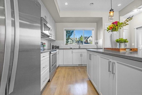 8048 Masters Boulevard Se, Calgary, AB - Indoor Photo Showing Kitchen With Upgraded Kitchen