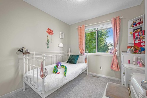 8048 Masters Boulevard Se, Calgary, AB - Indoor Photo Showing Bedroom
