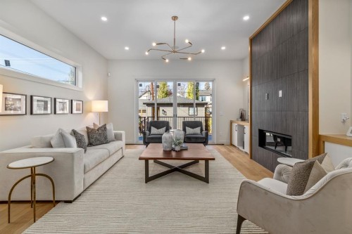 727 15 Street Nw, Calgary, AB - Indoor Photo Showing Living Room With Fireplace