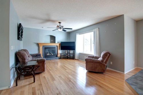 209 Sagewood Place Sw, Airdrie, AB - Indoor Photo Showing Living Room With Fireplace